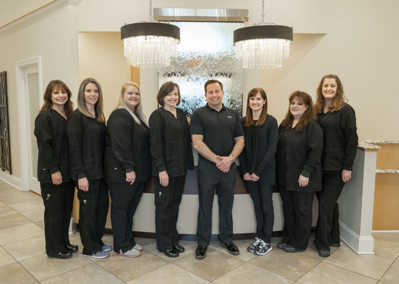 Dr. Burns and the staff posing